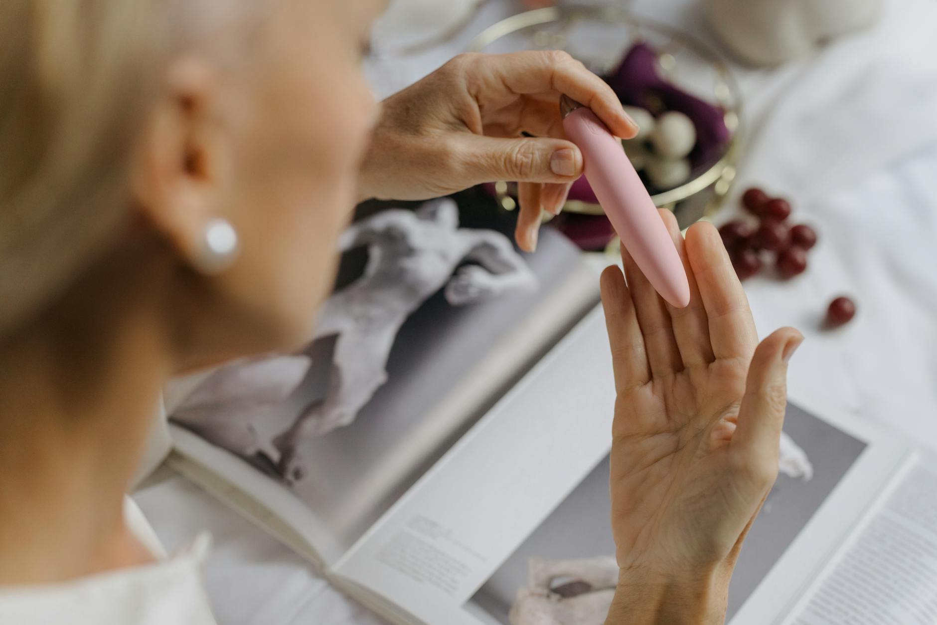Woman holding silicone vibrators, representing sexual agency and pleasure in relationships