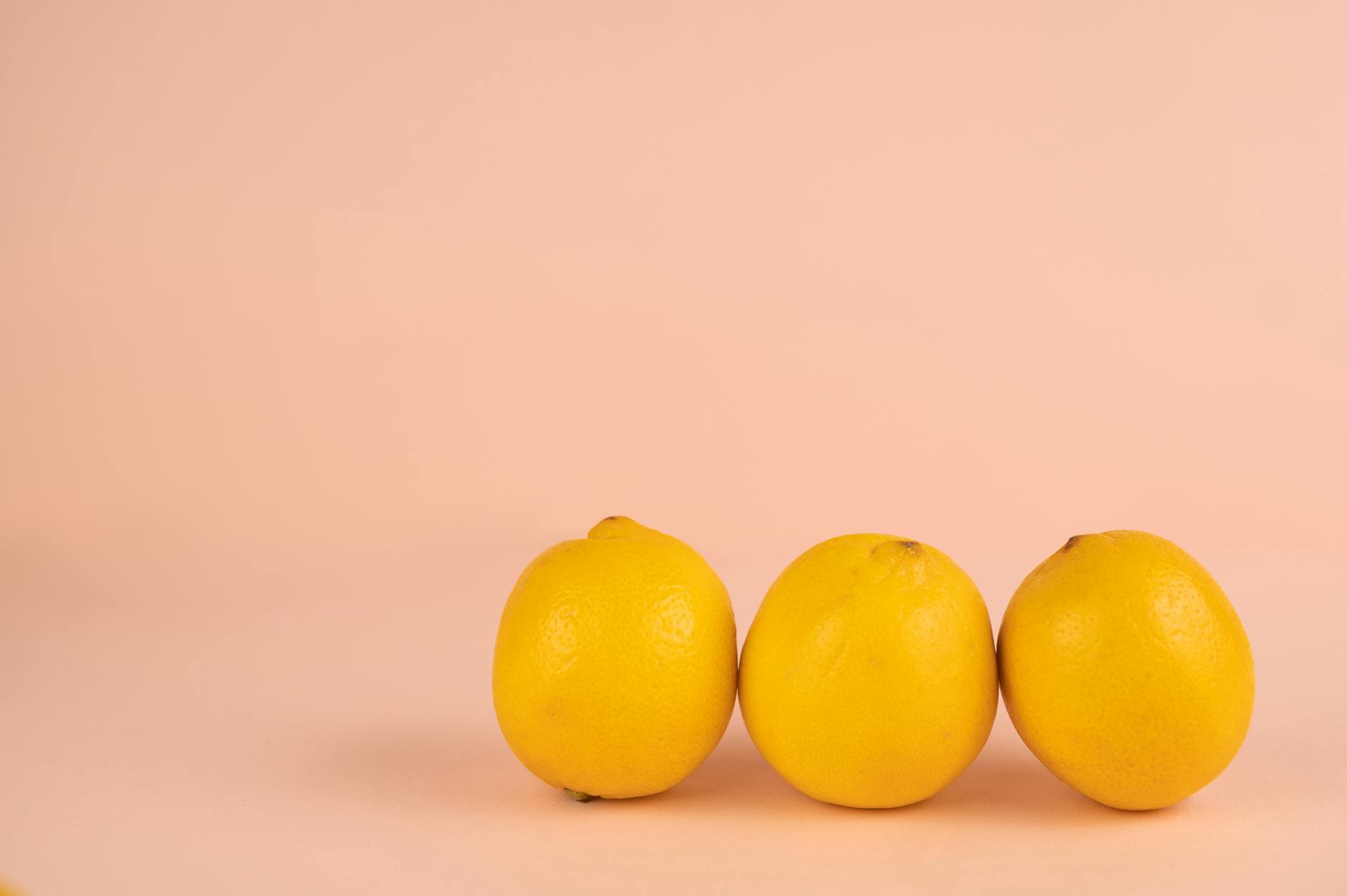 Bright ripe lemons arranged on a pastel background, symbolizing the slow build of natural arousal